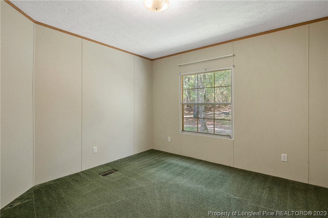 4759 Darroch Road Lillington, NC 27546 - Photo 32 of 50 a view of an empty room with a window