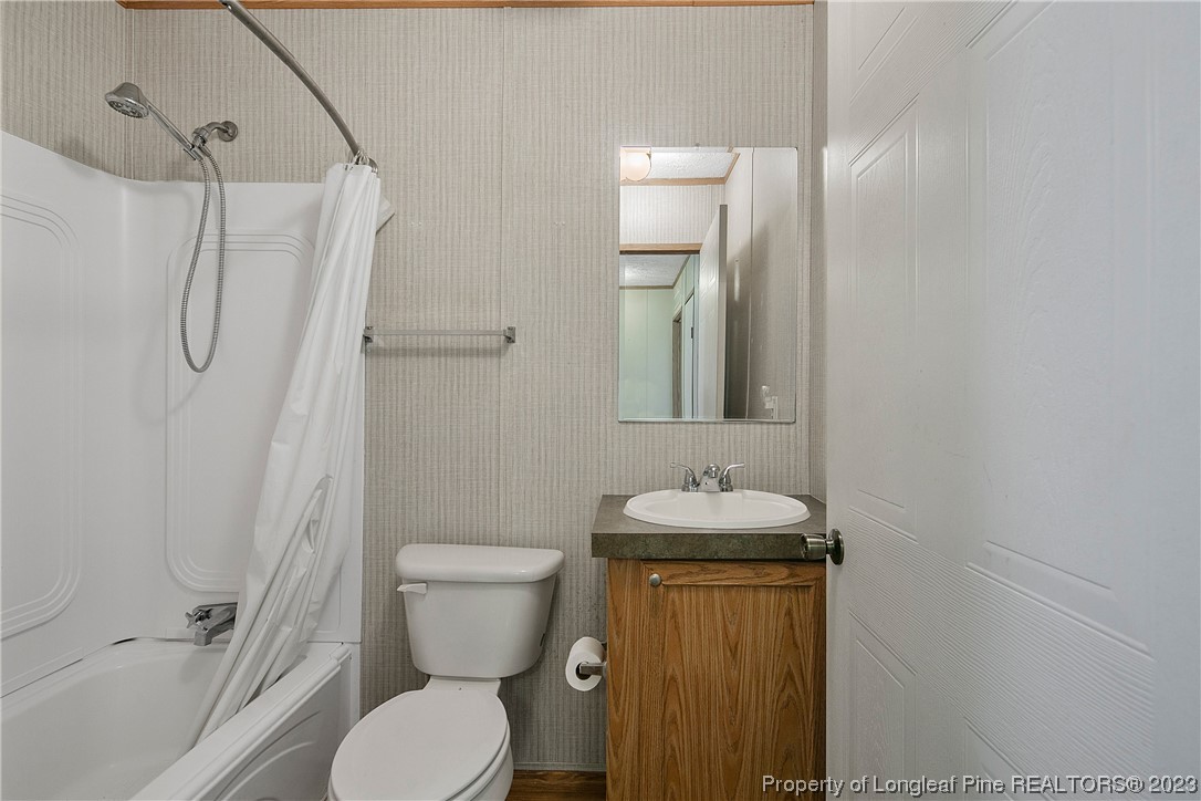 4759 Darroch Road Lillington, NC 27546 - Photo 35 of 50 a bathroom with a sink toilet and shower