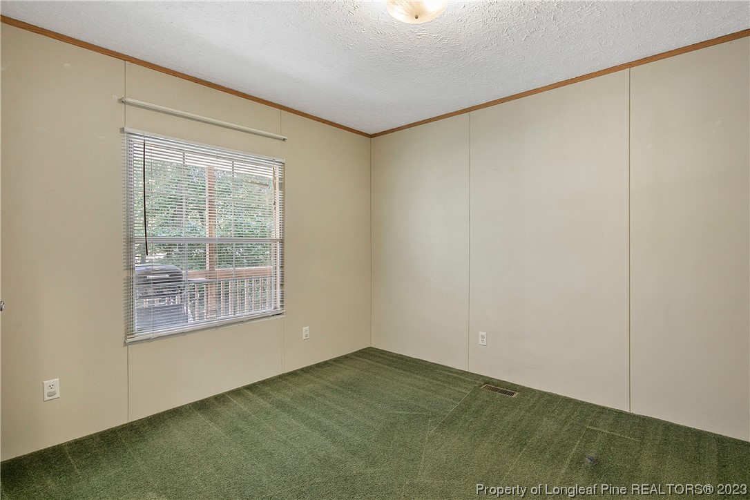 4759 Darroch Road Lillington, NC 27546 - Photo 39 of 50 a view of an empty room with a window