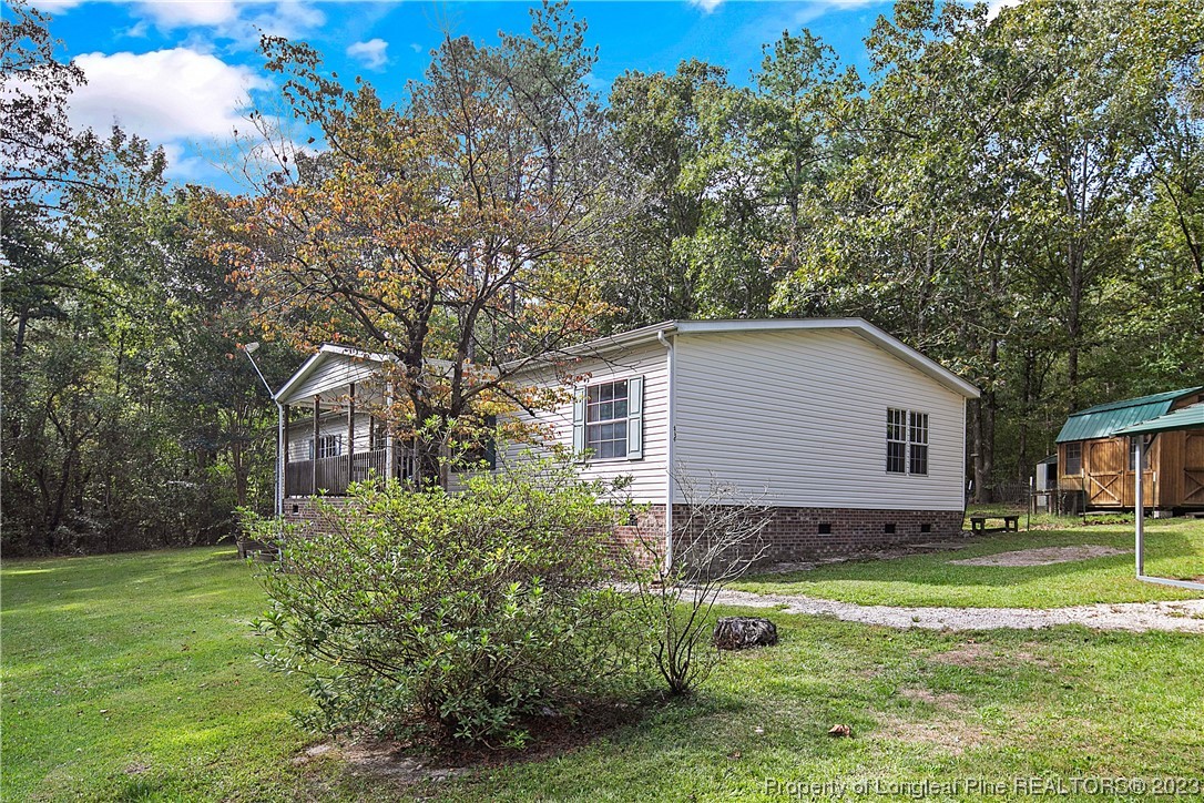 4759 Darroch Road Lillington, NC 27546 - Photo 4 of 50 a house view with a garden space
