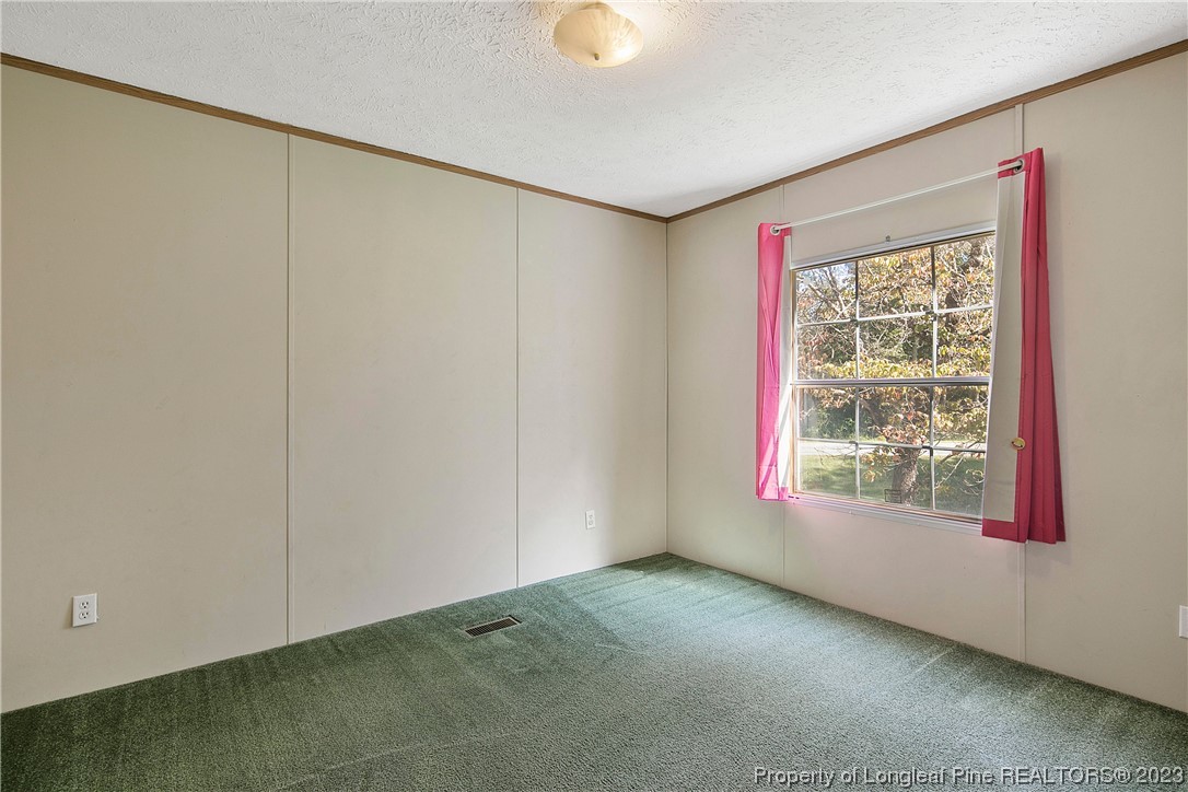 4759 Darroch Road Lillington, NC 27546 - Photo 43 of 50 a view of an empty room with a window