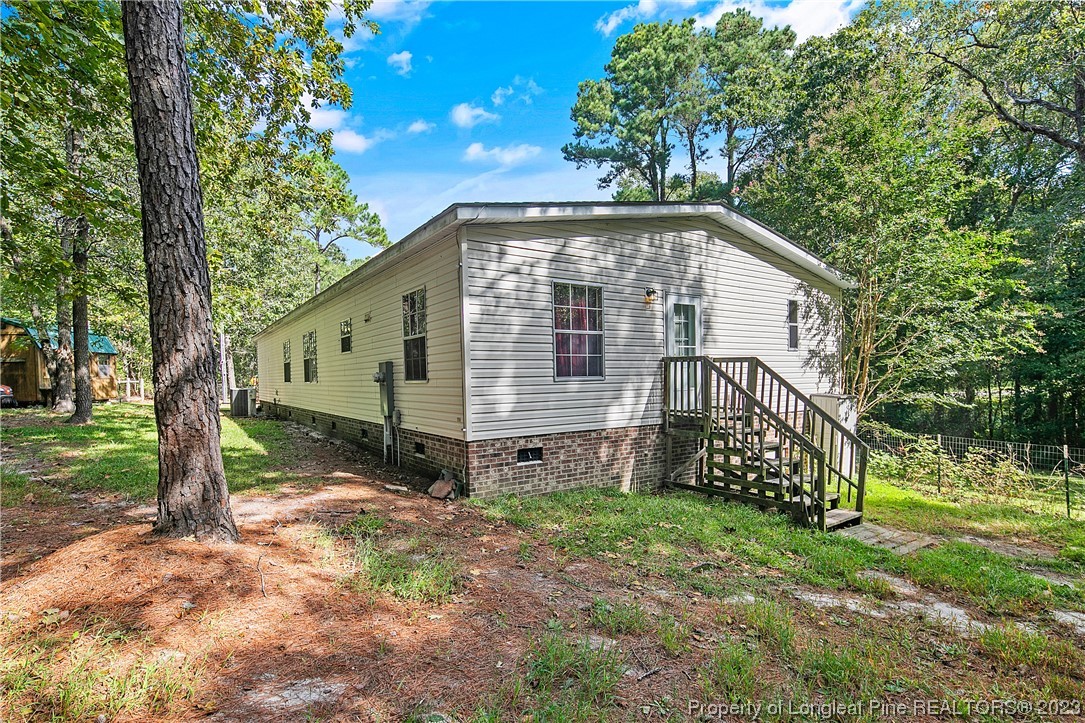 4759 Darroch Road Lillington, NC 27546 - Photo 48 of 50 a view of a house with a yard