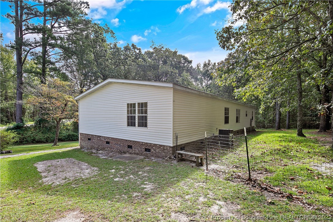 4759 Darroch Road Lillington, NC 27546 - Photo 49 of 50 a view of a backyard with a garden