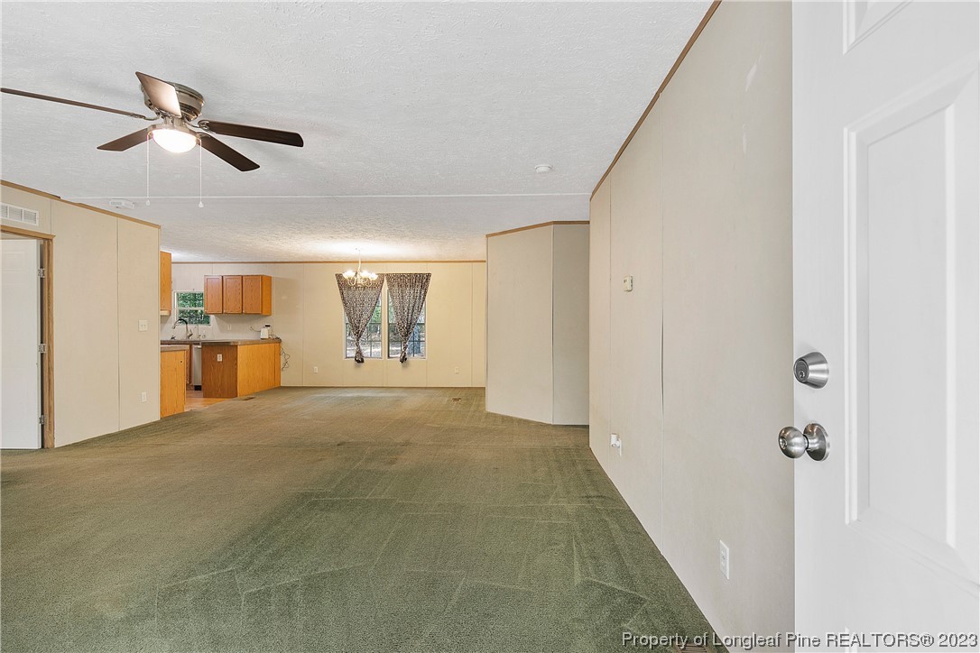 4759 Darroch Road Lillington, NC 27546 - Photo 6 of 50 a view of livingroom with hardwood floor and ceiling fan
