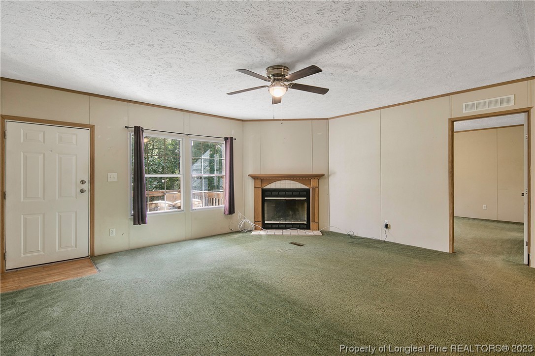 4759 Darroch Road Lillington, NC 27546 - Photo 8 of 50 a view of empty room with a fireplace