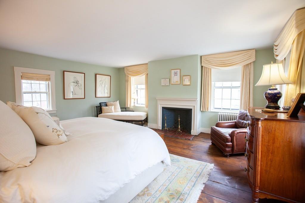 651 Boston Post Road Weston, MA 02493 - Photo 11 of 19 a spacious bedroom with a bed and wooden floor