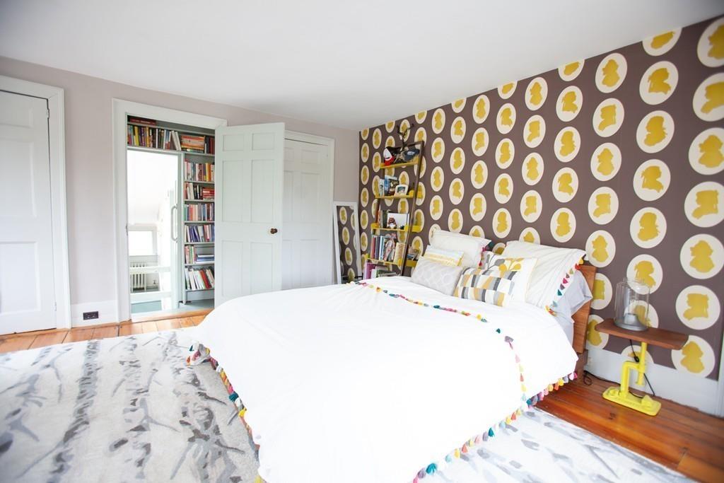651 Boston Post Road Weston, MA 02493 - Photo 12 of 19 a bedroom with a bed and wooden floor