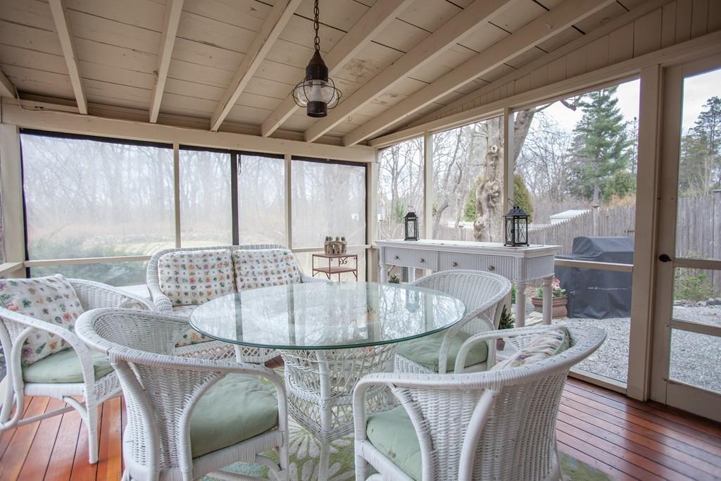 651 Boston Post Road Weston, MA 02493 - Photo 16 of 19 a dining room with furniture a chandelier and wooden floor
