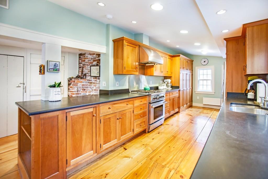 651 Boston Post Road Weston, MA 02493 - Photo 5 of 19 a large kitchen with kitchen island granite countertop a large counter top and sink