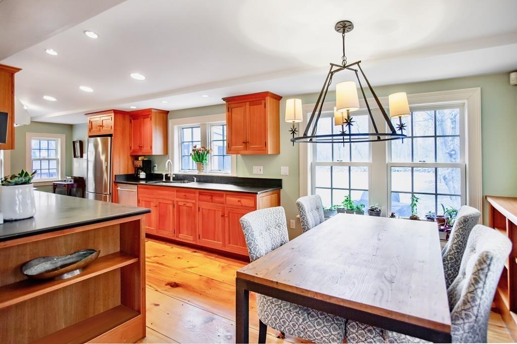 651 Boston Post Road Weston, MA 02493 - Photo 6 of 19 a living room with furniture a window and a dining table