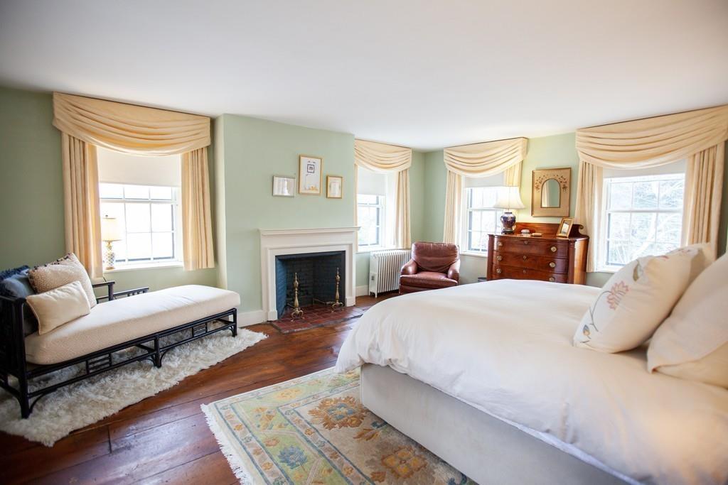 651 Boston Post Road Weston, MA 02493 - Photo 10 of 19 a spacious bedroom with a bed and wooden floor