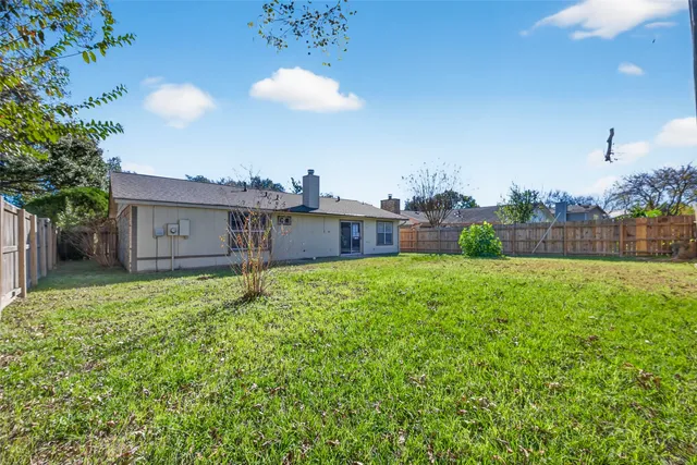 a view of a back yard of the house