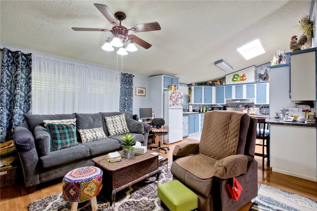34370 The Farm Road Wildomar, CA 92595 - Photo 14 of 31 a living room with furniture and a flat screen tv