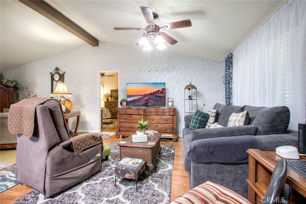 34370 The Farm Road Wildomar, CA 92595 - Photo 15 of 31 a living room with furniture and a chandelier