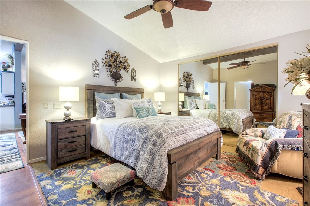 34370 The Farm Road Wildomar, CA 92595 - Photo 20 of 31 a bed room with a bed and a chandelier