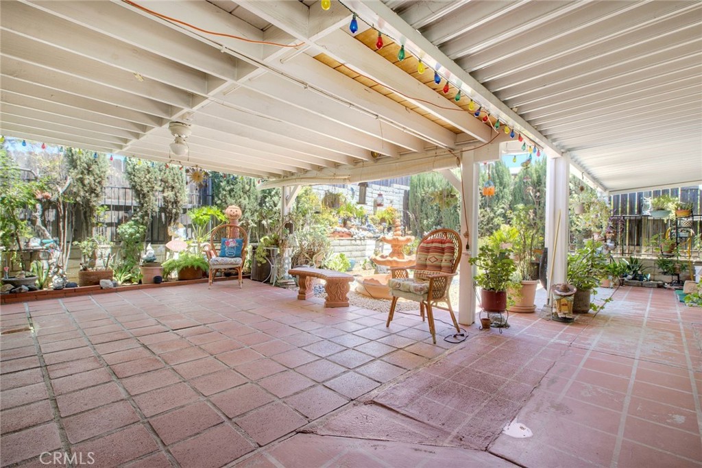 34370 The Farm Road Wildomar, CA 92595 - Photo 30 of 31 a view of a patio with table and chairs potted plants with wooden floor
