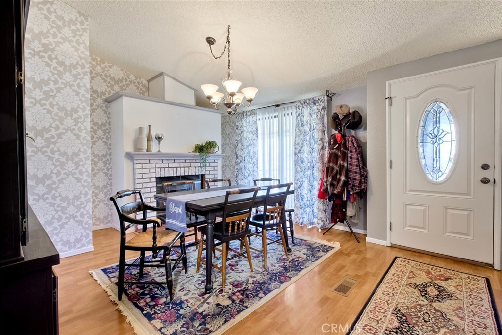 34370 The Farm Road Wildomar, CA 92595 - Photo 8 of 31 a view of a dining room with furniture and a chandelier