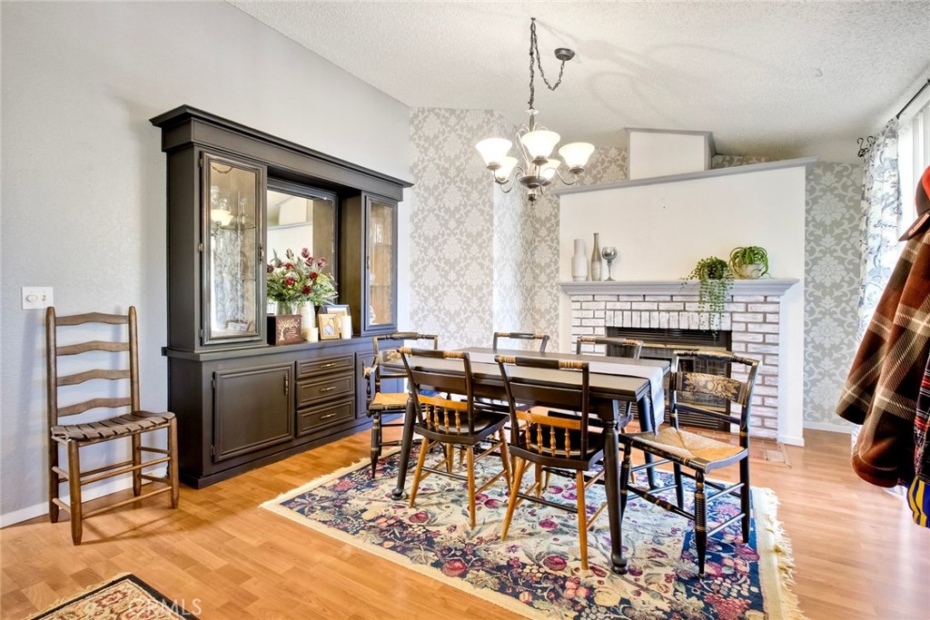 34370 The Farm Road Wildomar, CA 92595 - Photo 9 of 31 a view of a dining room with furniture window and wooden floor