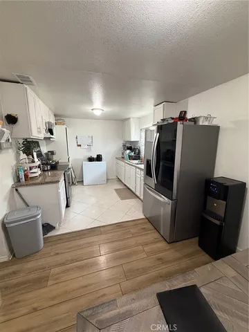 a living room with furniture window and flat screen tv