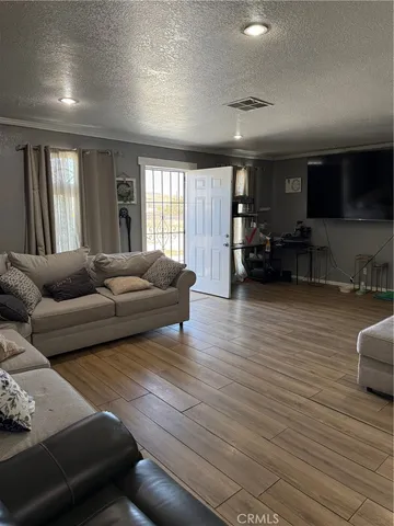 a kitchen with stainless steel appliances a stove a sink and a refrigerator