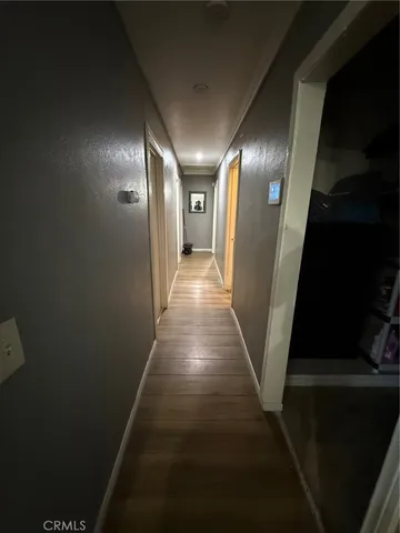 a view of a livingroom with furniture window and wooden floor