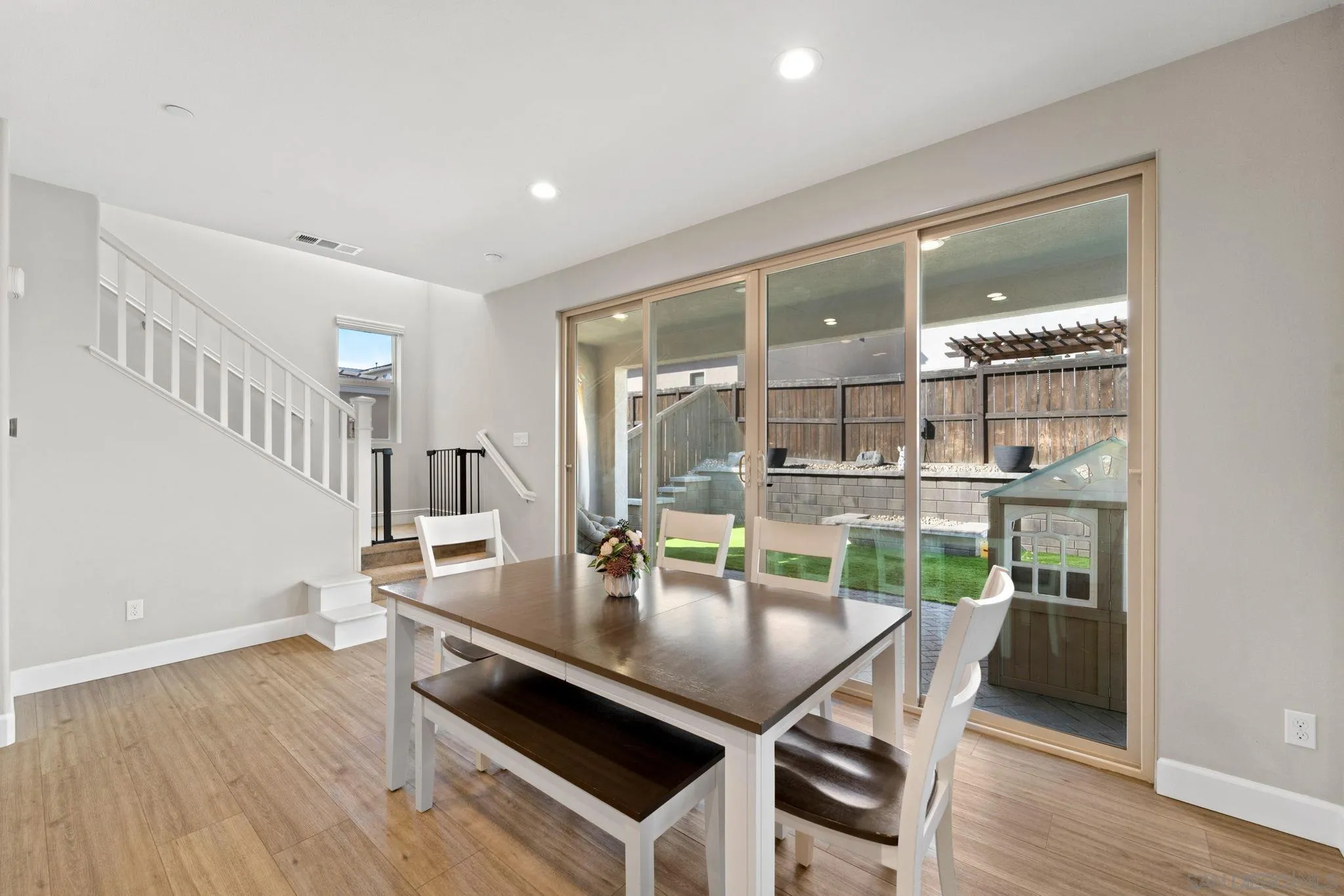 1279 Camino Prado Chula Vista, CA 91913 - Photo 14 of 38 a view of a dining room with furniture window and wooden floor