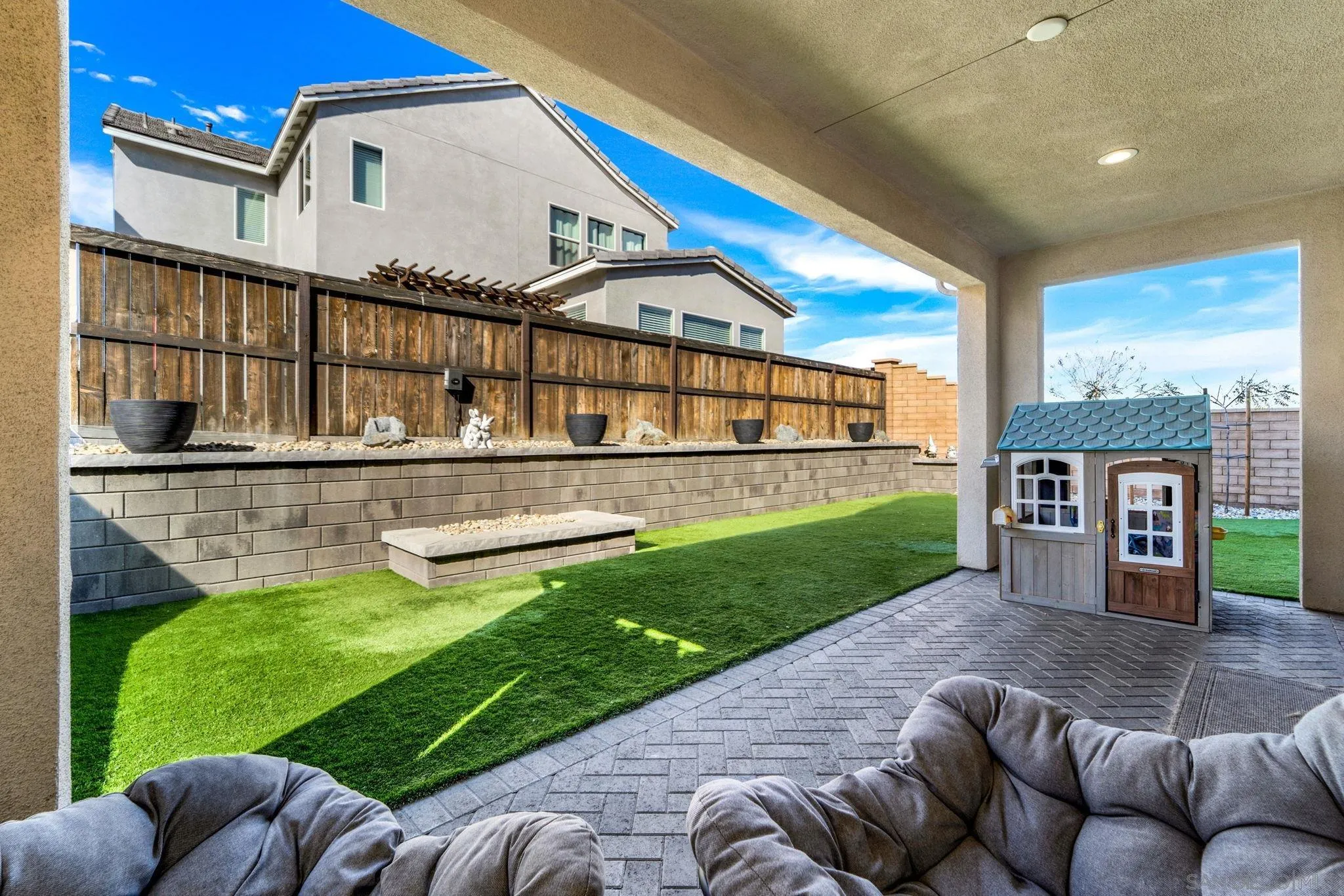 1279 Camino Prado Chula Vista, CA 91913 - Photo 15 of 38 a view of a house with a big yard and a large tree
