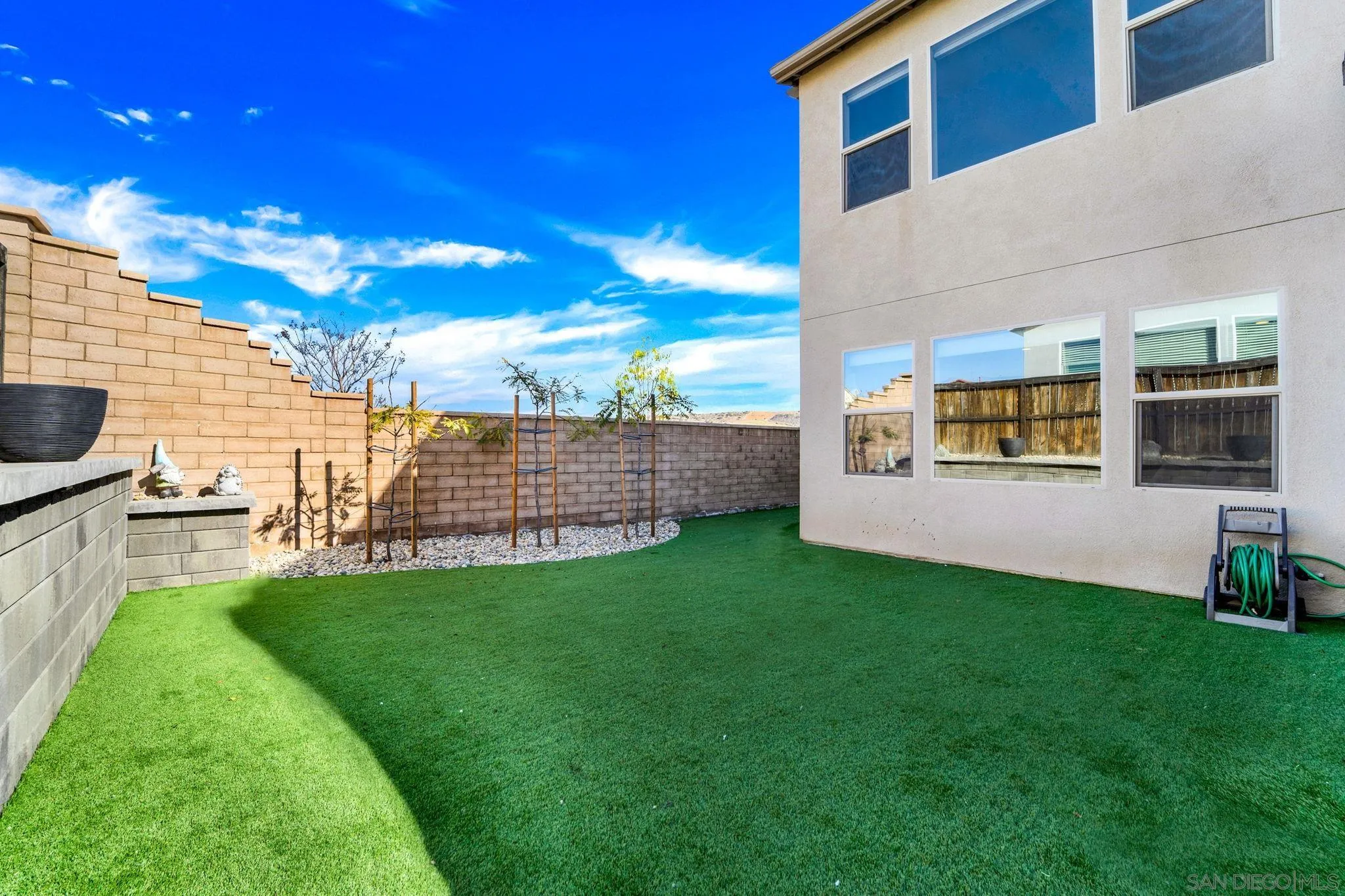 1279 Camino Prado Chula Vista, CA 91913 - Photo 18 of 38 a view of a backyard with couches plants and large tree