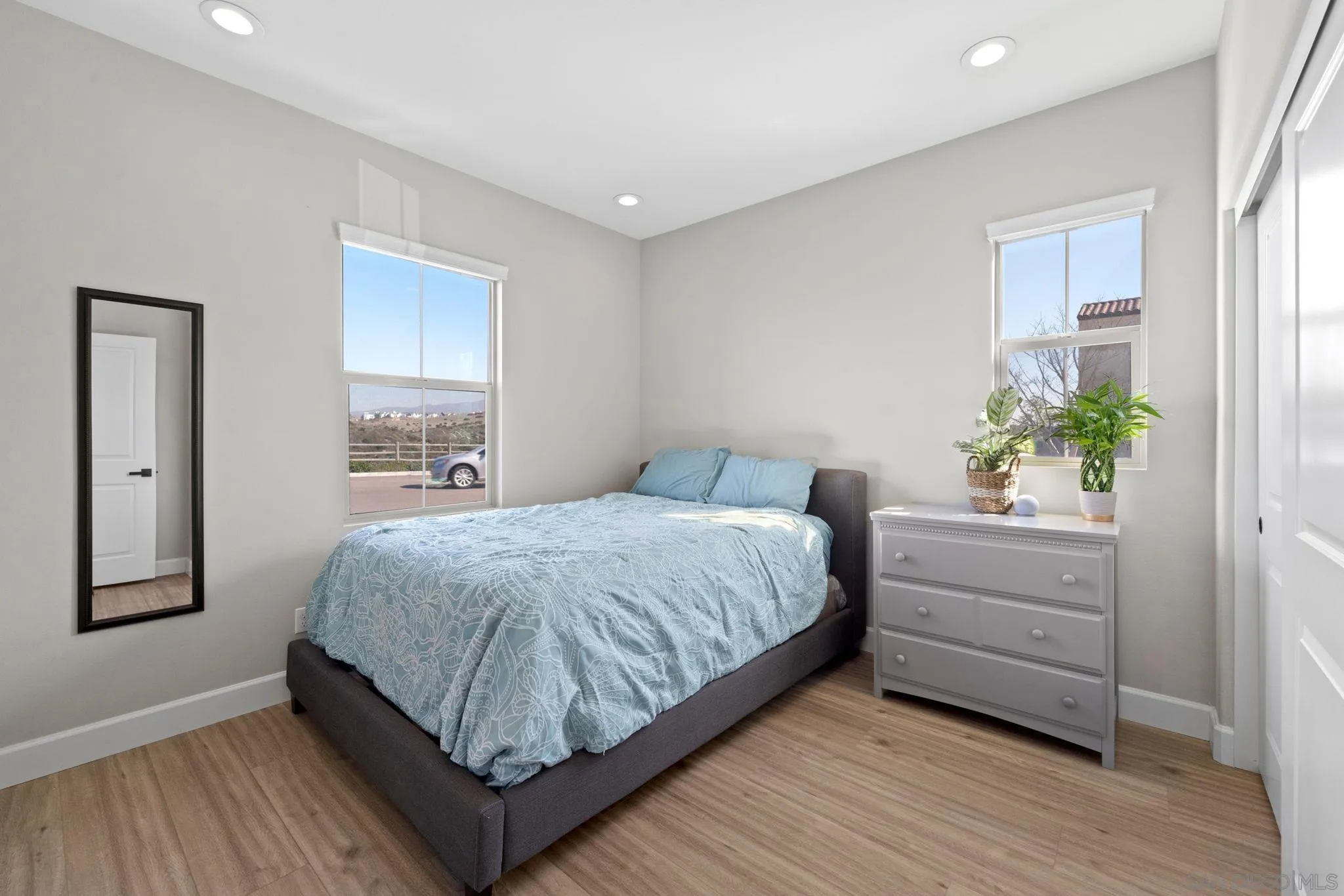 1279 Camino Prado Chula Vista, CA 91913 - Photo 19 of 38 a bedroom with a bed and window