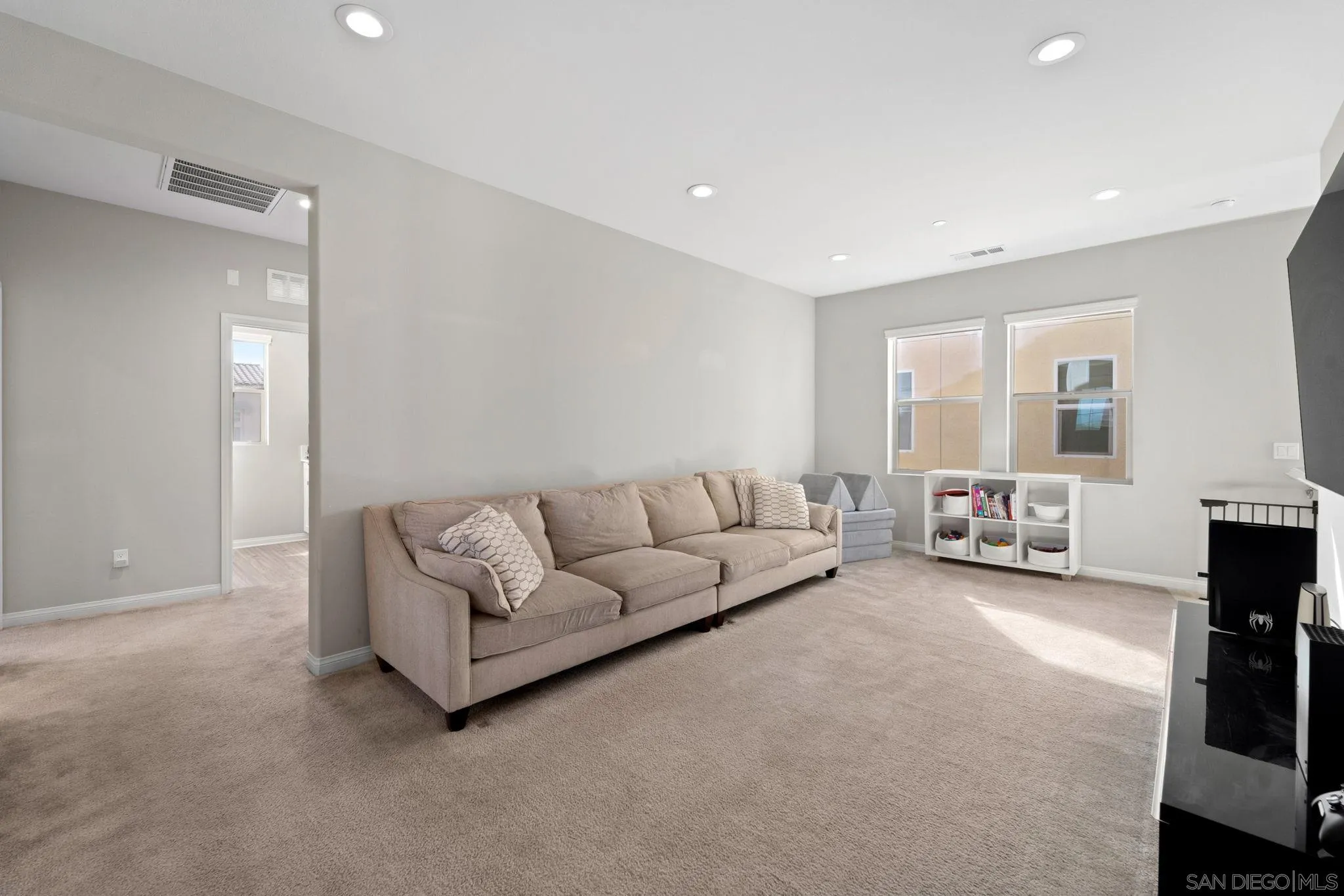 1279 Camino Prado Chula Vista, CA 91913 - Photo 23 of 38 a living room with furniture and a flat screen tv