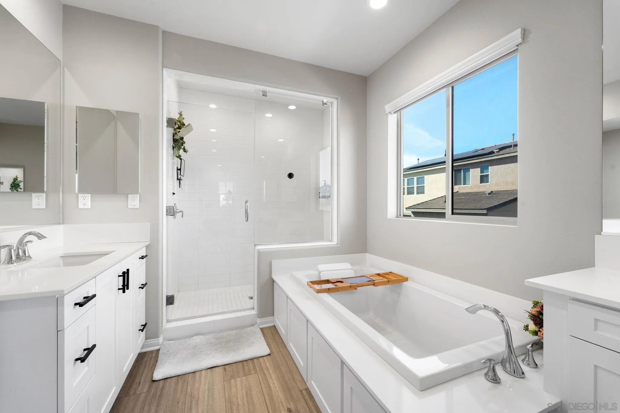 1279 Camino Prado Chula Vista, CA 91913 - Photo 27 of 38 a bathroom with a tub sink and mirror