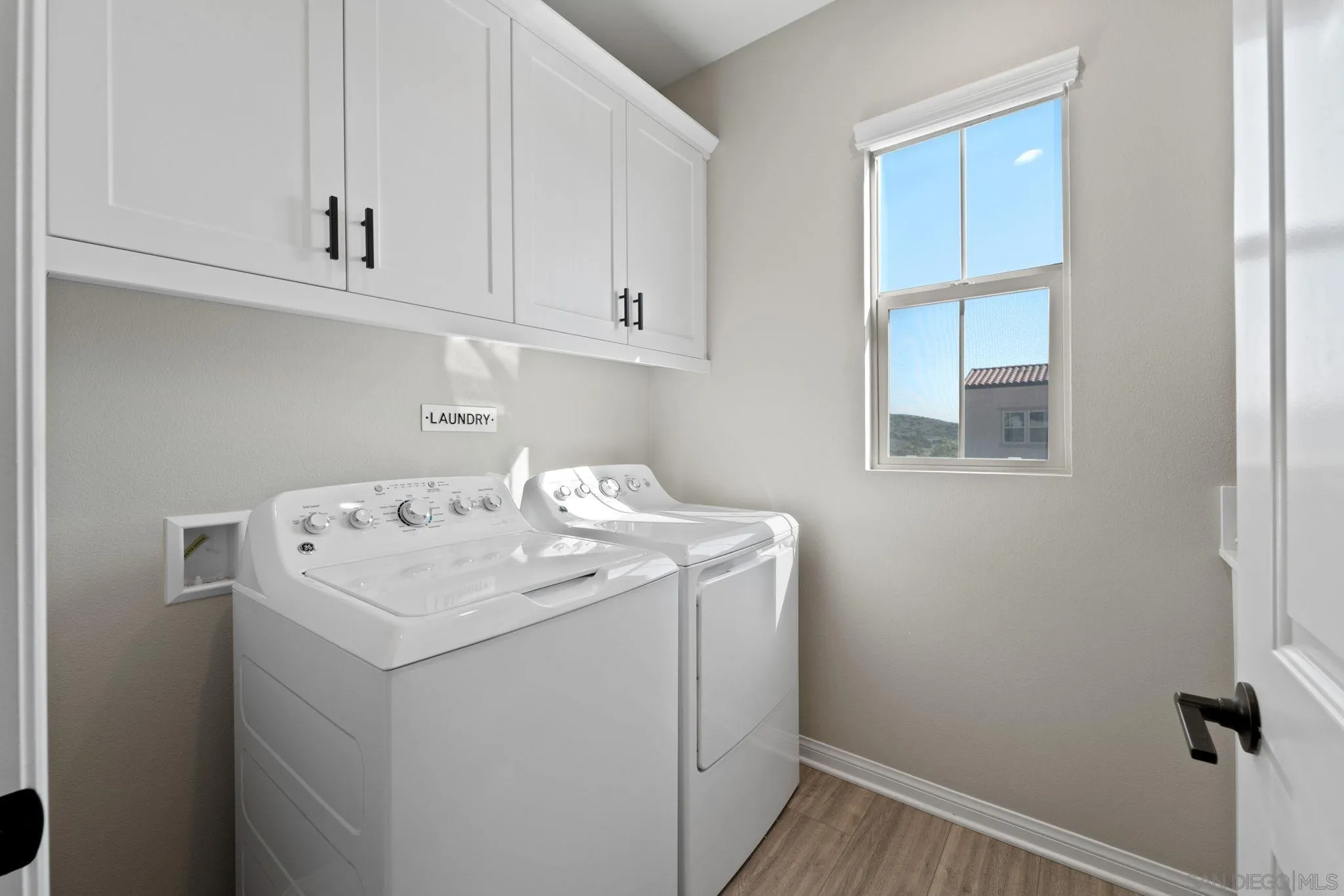 1279 Camino Prado Chula Vista, CA 91913 - Photo 32 of 38 a utility room with dryer and washer