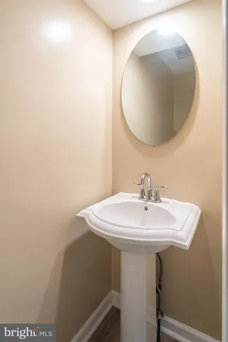 a bathroom with a sink and mirror