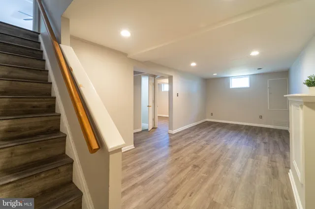 wooden floor in an empty room with stairs