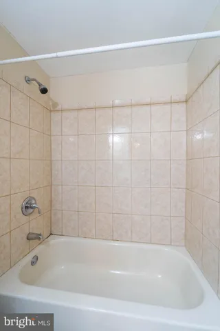 a bathroom with a shower and a bathtub