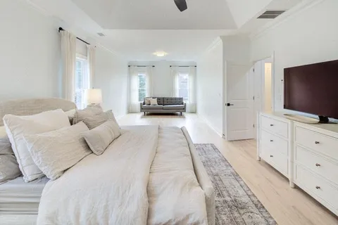 a bed room with a bed and a television