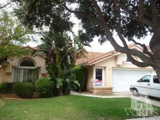 a front view of a house with a yard and porch
