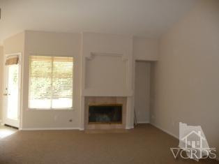 2409 Grapevine Drive Oxnard, CA 93036 - Photo 4 of 4 a room with a fireplace and a window