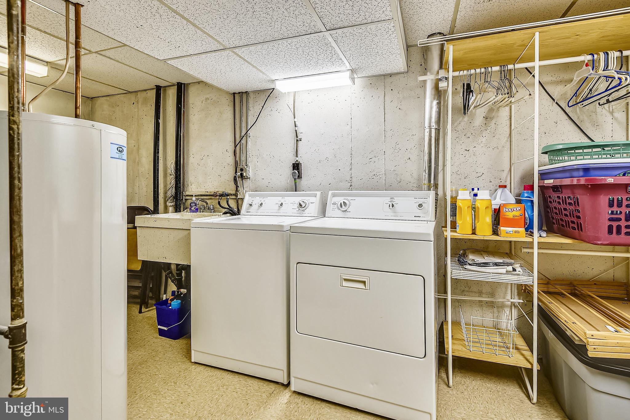 2232 Countryside Drive Silver Spring, MD 20905 - Photo 45 of 72 LAUNDRY ROOM WITH SHELVES, WASH TUB, TABLE