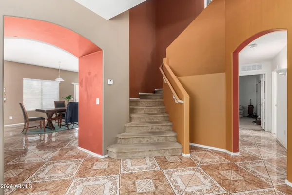 a view of a hallway with dining area and entryway