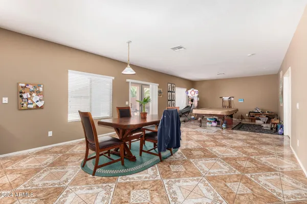 a view of a dining room with furniture