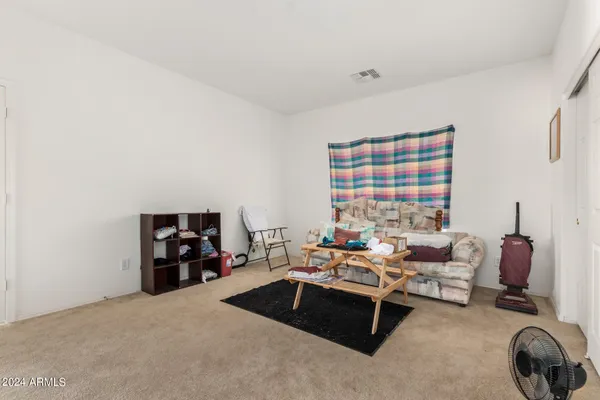 a bedroom with furniture and closet