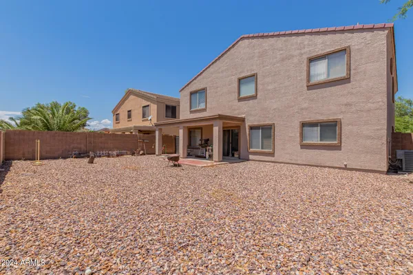 a house view with a backyard space