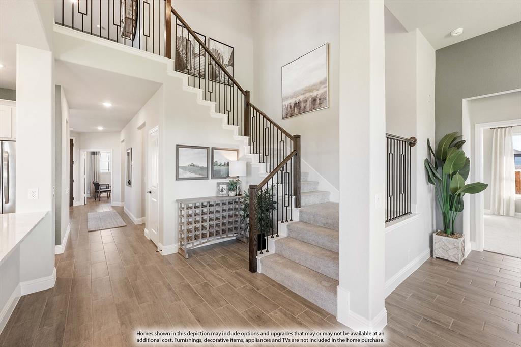 5214 Stone Lane Midlothian, TX 76065 - Photo 23 of 40 a view of entryway with wooden floor and stairs