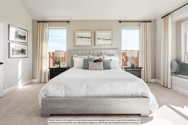 a bedroom with a large bed and a large window