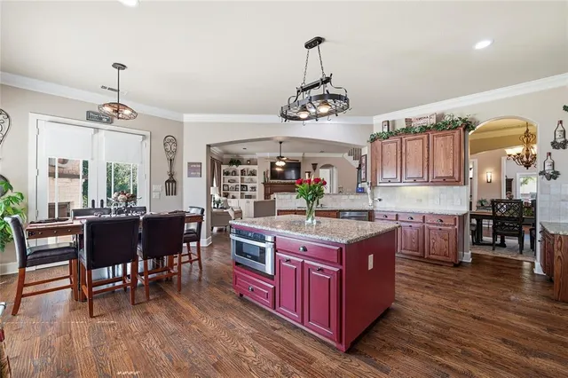 a bedroom with bed and wooden floor