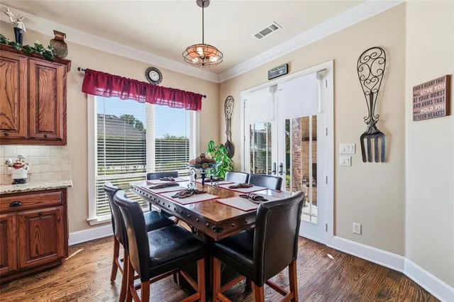 a spacious bathroom with a granite countertop sink a mirror and shower