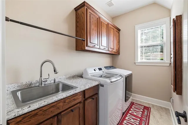 a bathroom with a sink and a window