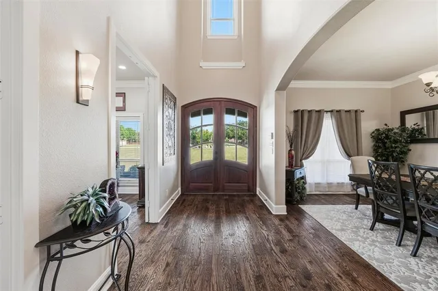 a view of entryway livingroom and hall with wooden floor