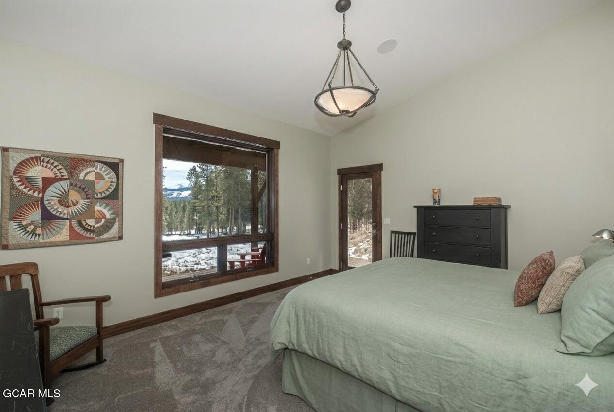 492 Mountain Peak Road Tabernash, CO 80478 - Photo 11 of 29 a bedroom with a bed and a window